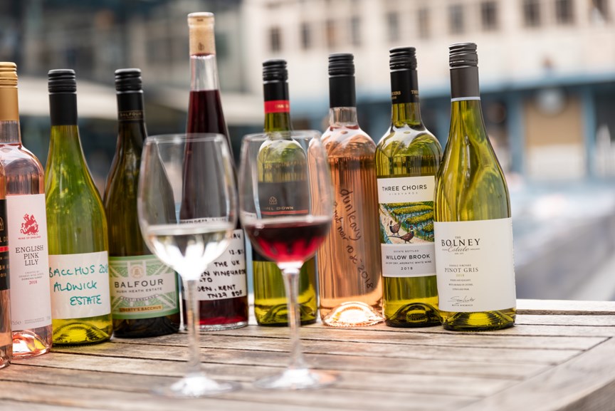 Image of Famous Red and Sparkling Wine Bottles with Labels Placed on a Table