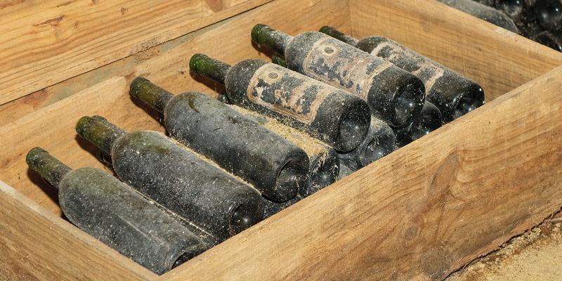 Image Showing A Group of Wine Bottles Stored in a Wooden Box