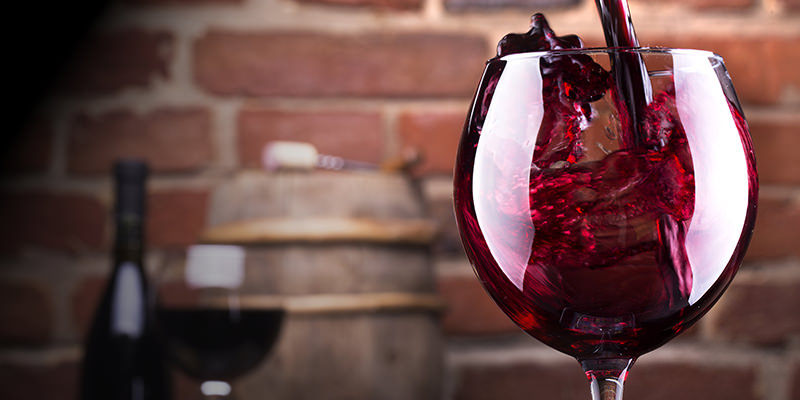 A Beautiful Image of Pouring Red Wine into The Glass