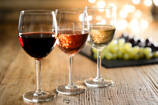 Image Showing Three Glass of Wines Placed Infront of Grapes