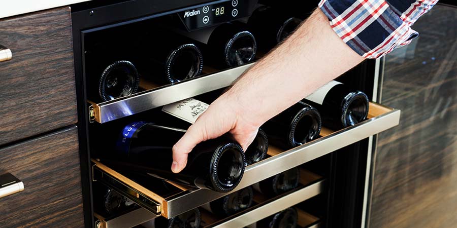 A Man keeps his Wine Bottle Inside The Wine rack